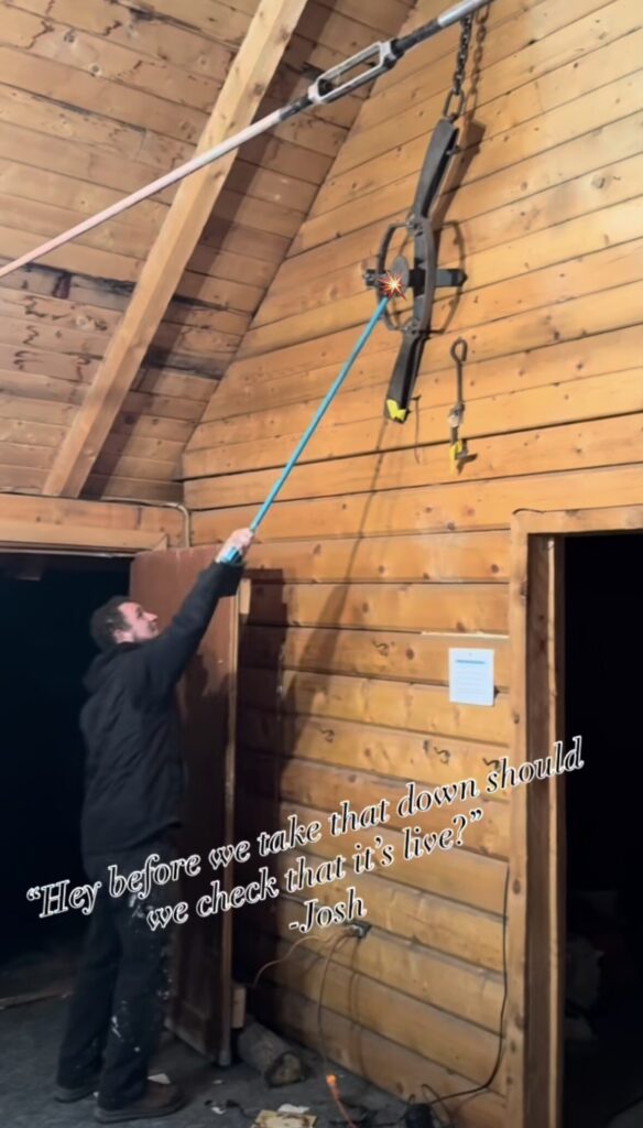 Pencil Log Pros is testing a bear trap with a broom.